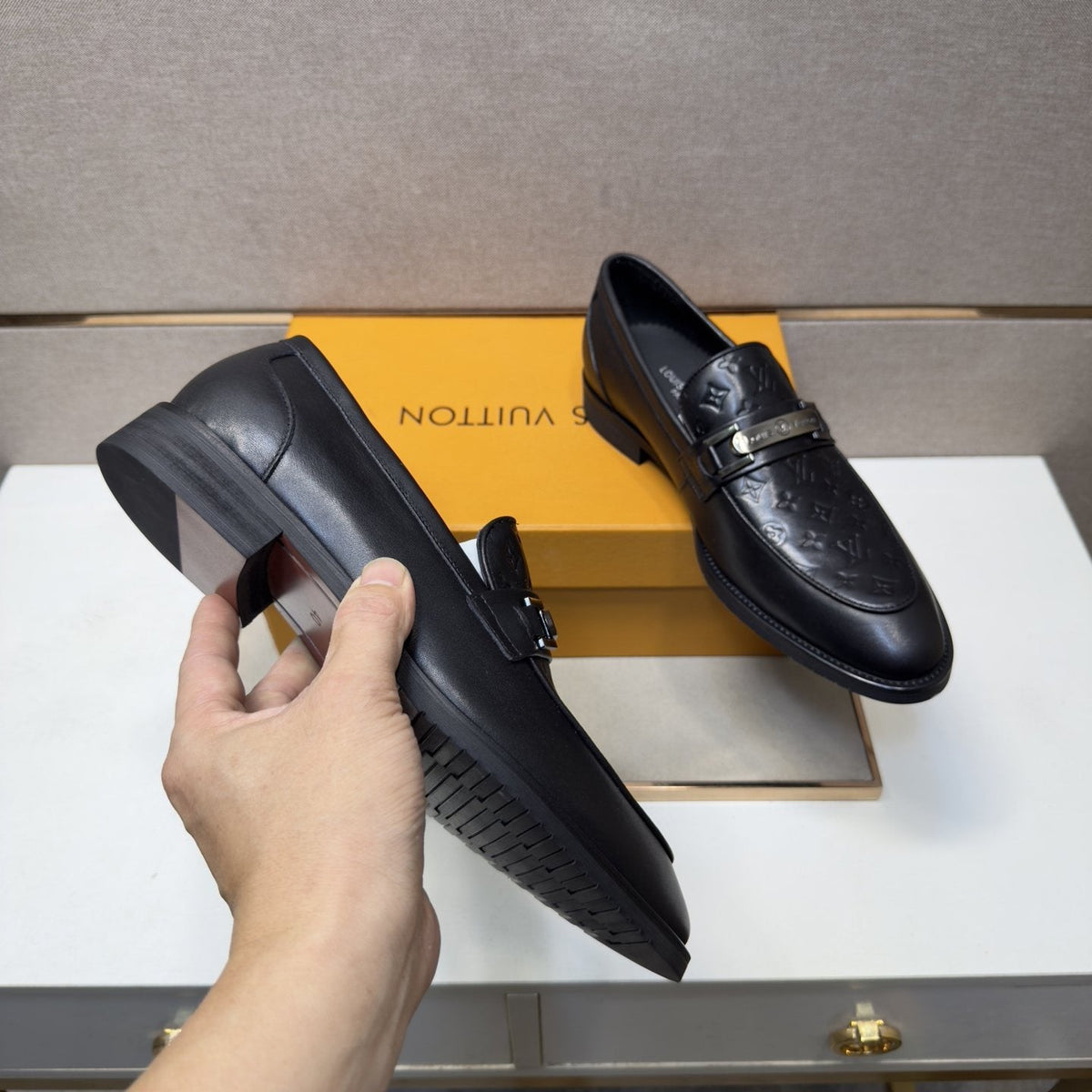 Louis Vuitton Embossed Metal-Bar Loafers — model